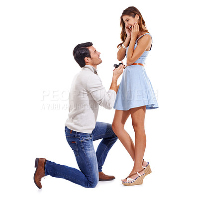 Buy stock photo Full-length studio shot of a young couple getting engaged isolated on white