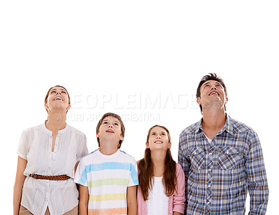 Buy stock photo Mother, father and kids on a white background looking up for bonding, relationship and mockup space. Family, love and isolated mom, dad and children for news, information and announcement in studio
