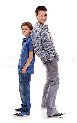 Buy stock photo A father and son standing back to back against a white background