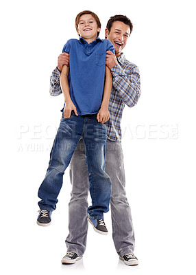Buy stock photo Portrait, playing and father with child on a white background for bonding, relationship and love. Family, parenthood and dad lift, carry and smile with son for support, care and affection in studio