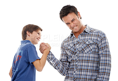 Buy stock photo Father, portrait and arm wrestle with child for game of strength, power or playful bonding on a white studio background. Dad, son or kid with handshake in battle for challenge, parenting or childhood