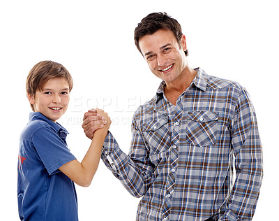 Buy stock photo Dad, portrait and arm wrestle with child for game of strength, power or playful bonding on a white studio background. Father, son or kid with handshake in battle for challenge, parenting or childhood