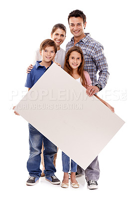 Buy stock photo Parents, children and studio with blank poster in portrait with smile for bonding, love and space by white background. Mother, father and kids with mockup, promotion and happy together with family