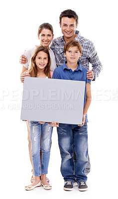 Buy stock photo Parents, children and studio with space on poster in portrait with smile for bonding, love and empty by white background. Mother, father and kids with mock up, promotion or happy together with family