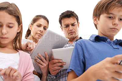 Buy stock photo Mother, father and children with tablet for distraction on internet, website and online games. Family, ignore and mom, dad and kids on digital tech for streaming, connection and videos in studio
