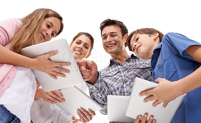 Buy stock photo happy, family and children with tablet on a white background for internet, website or online games. Family, below and mom, dad and kids on digital tech for streaming, connection and videos in studio