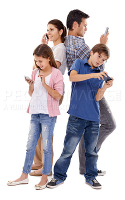 Buy stock photo Studio shot of four family members each using their own mobile phones