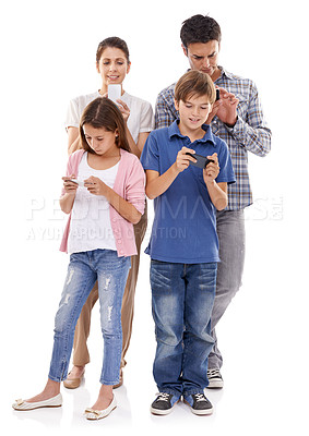Buy stock photo Family, phone and online in studio for communication with text message, conversation and video streaming. Father, mother and children with smartphone, technology and mobile chat on white background