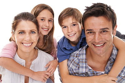 Buy stock photo Happy family, portrait and hug with children for bonding, embrace or support on a white studio background. Face of mother, father and kids with smile for love, care or trust on holiday or weekend
