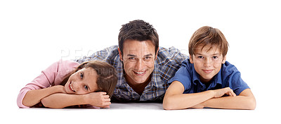 Buy stock photo Happy, white background and dad and kids on floor for bonding, relationship and love. Family, parenthood and dad hug, embrace and smile with girl and boy for support, care and affection in studio