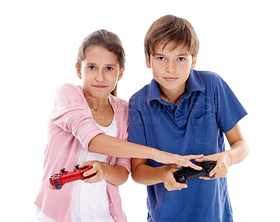 Buy stock photo Children, video game and controller for siblings in studio, portrait and competition by white background. Girl, boy or family kids with gaming, press and contest with strategy, cheating or playing