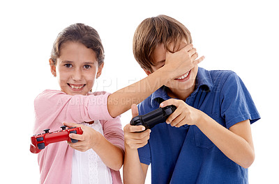 Buy stock photo Kids, gaming and controller for siblings in studio, portrait and cover eyes by white background. Girl, boy and family children with video game, press and contest with strategy, cheating or playing