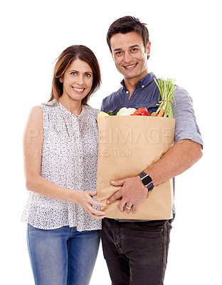 Buy stock photo Happy couple, portrait and bag with groceries for food, natural sustainability or fashion on a white studio background. Man and woman with smile for grocery shopping, casual clothing or supermarket