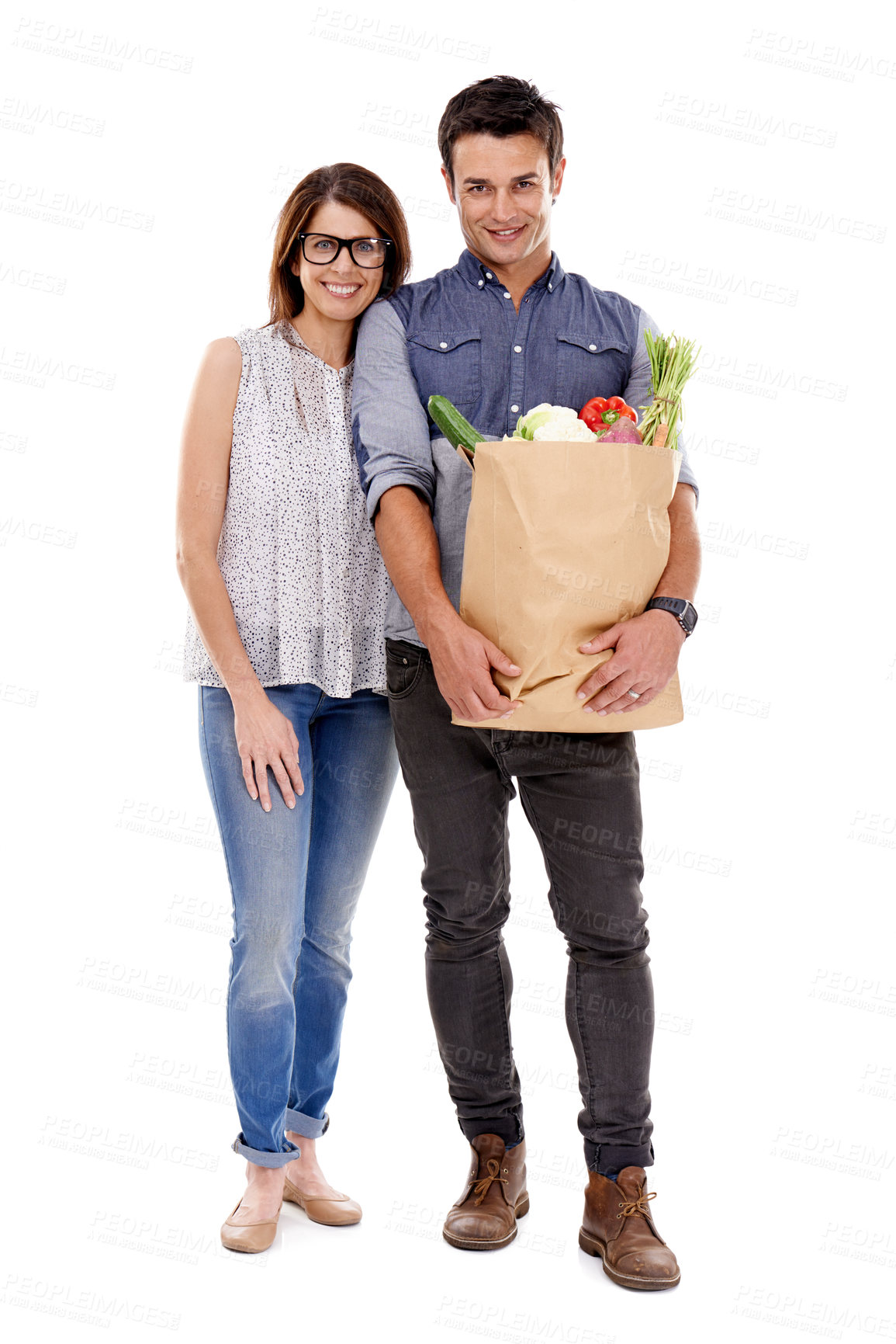 Buy stock photo Happy couple, portrait and shopping with grocery bag for food, natural sustainability or nutrition on a white studio background. Young man and woman with smile for healthy vegetables or ingredients