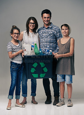 Buy stock photo Parents, kids and studio portrait with recycling for sustainability, ecology and background. Mother, father and children in family with container, plastic and bottle for cleaning environment