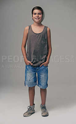 Buy stock photo Happy boy, portrait and fashion with style in denim shorts or jeans on a gray studio background. Male person, child or teenager with summer clothing or cool stylish outfit with winter cap on mockup