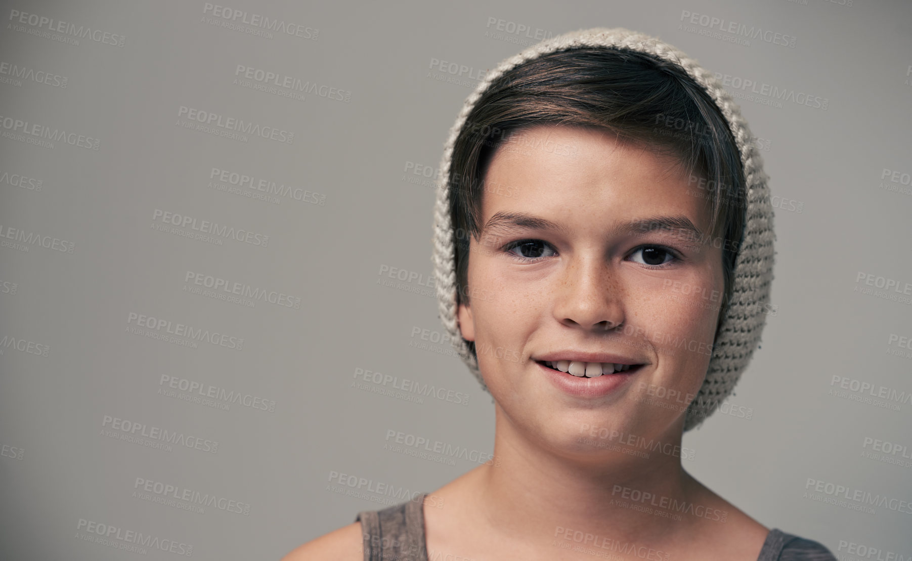 Buy stock photo Boy, kid and beanie in studio for portrait with smile, mockup and space for fashion by background. Child, model and hat with trendy style, happy and pride for clothes with confidence for punk outfit