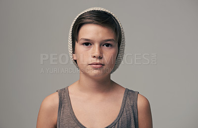 Buy stock photo Boy, beanie and fashion in studio for portrait with teenager, edgy and aesthetic by background. Kid, model and hat with trendy style, face and pride for clothes with confidence for punk outfit