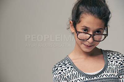 Buy stock photo Girl, child and glasses in studio with space, thinking and mock up for style, vision and eye care by background. Kid, model and frame with eyesight, wellness and nerd for optometry in childhood