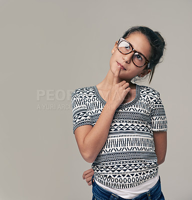 Buy stock photo Girl, face and thinking with fashion for decision, choice or idea on a gray studio background. Female student, child or kid in thought or wonder for memory, reminder or brainstorming on mockup