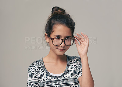 Buy stock photo Kids, vision and glasses with happy girl child in studio isolated on gray background for optometry. Children, frame and eyewear with young female kid at eye clinic for prescription eyesight test