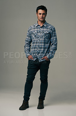 Buy stock photo Man, portrait and fashion with denim jeans, clothes or style on a gray studio background. Male person, adult or young model with casual clothing, shirt or stylish outfit in confidence on mockup space
