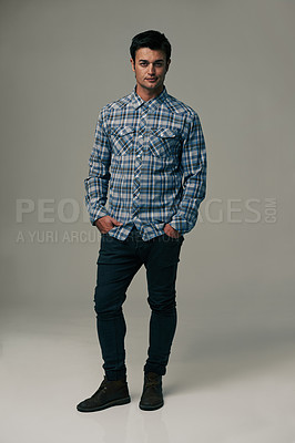 Buy stock photo Handsome man, portrait and fashion with style or jeans on a gray studio background. Male person, adult or young model with casual clothing or stylish outfit in confidence on mockup or apparel space