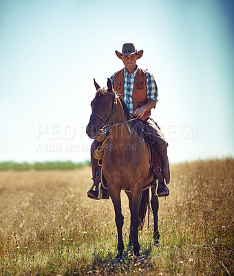 Buy stock photo Man, portrait and horse riding in countryside as cowboy or adventure in Texas meadow for explore, exercise or training. Male person, animal and stallion in rural environment on saddle, ranch or hobby