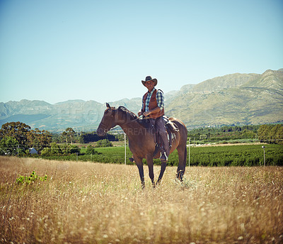 Buy stock photo Full-length portrait of a mature man on a horse out in a field