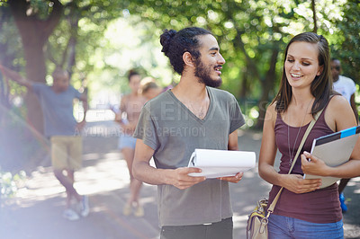 Buy stock photo Students, friends and planning or talking on campus with education, knowledge and notebook or notes at college. Happy people with outdoor conversation in park or university for studying collaboration