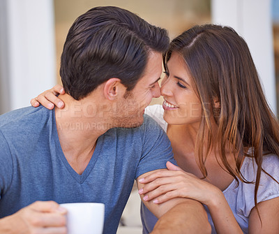 Buy stock photo Happy couple, coffee and love with romance for morning or affection together at home. Face of young man and woman with smile, cup of tea or cappuccino for intimacy, support or care in trust at house