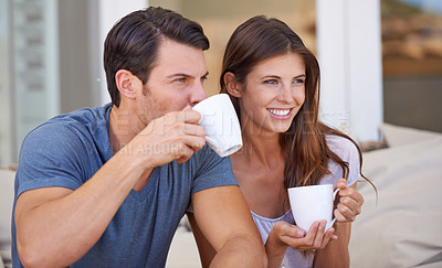 Buy stock photo Couple, morning and lounge with coffee in home for smile, thinking and relax on sofa with drink. Man, woman and happy together with latter, coco or tea cup with bonding, love and ideas on vacation