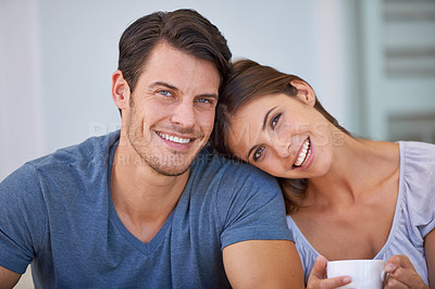 Buy stock photo Happy couple, portrait and coffee with love for morning, bonding or weekend together at home. Face of young man and woman with smile, cup of tea or cappuccino for support, care or trust at apartment