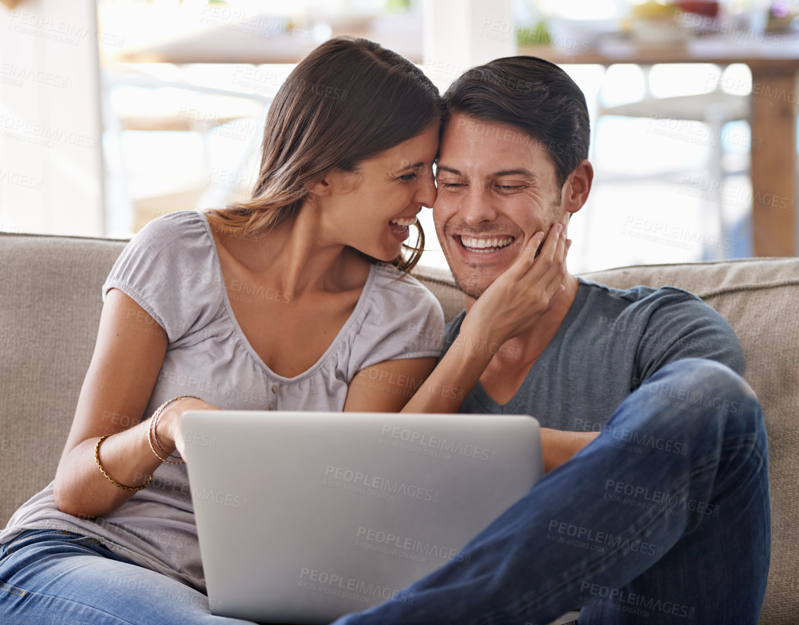 Buy stock photo Happy couple, laptop and love on sofa with good news, support or care in living room at home. Excited man or woman with smile on computer together for online browsing, alert or notification at house