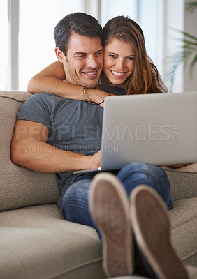 Buy stock photo Laptop, smile and woman embracing man on sofa networking on social media, website or internet. Happy, love and female person hugging husband reading online blog with computer in living room at home.