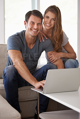Buy stock photo Couple, home and portrait with laptop, bonding and entertainment in living room with smile and laugh. Man, woman and sofa with embrace, relax and love while sitting at tech in lounge at house 