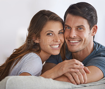 Buy stock photo Happy couple, face and portrait with love in relax on sofa for bonding, holiday or weekend together at home. Young man and woman with smile for support, care or relationship in living room at house