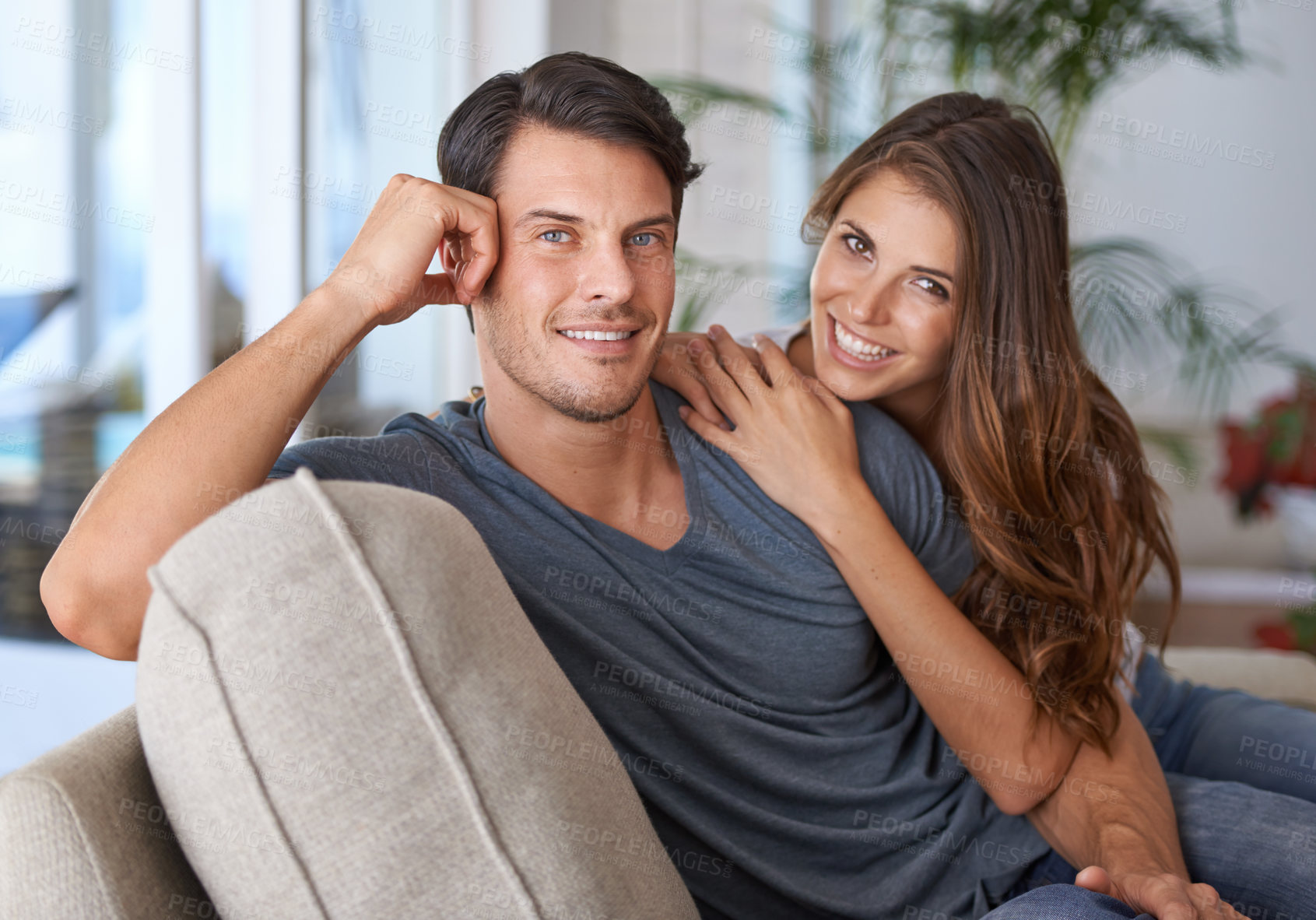 Buy stock photo Love, portrait of a happy couple bonding and on sofa in living room in their house. Marriage or relationship, romantic or intimate and relax or quality time together at home on couch in lounge