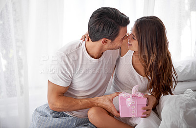 Buy stock photo Man giving woman present, love and happiness with partnership, relationship and celebration on Valentines day date. Couple smile with gift box, luxury and commitment, gratitude and celebrate holiday