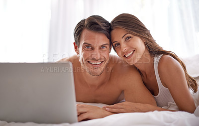 Buy stock photo Laptop, love and portrait of a couple in bed together while watching a online movie or video at their home. Happiness, smile and woman browsing the internet on computer with her husband in bedroom.