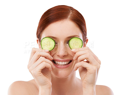 Buy stock photo Woman, smile and cucumber in studio for skincare with natural beauty, shine and hydration benefit on white background. Face, cosmetics and hand with fruit for vitamin c, dermatology and self care