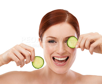 Buy stock photo Woman, smile and face with cucumber in studio for skincare, beauty and self care benefit on white background. Portrait, cosmetic and hands with fruit for vitamin c, dermatology and natural glow