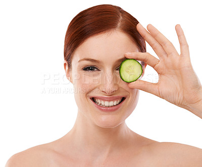Buy stock photo Portrait, skincare and woman with cucumber in studio for beauty, shine or collagen benefit on white background. Face, cosmetics and hand with green fruit for dermatology, vitamin c and organic facial