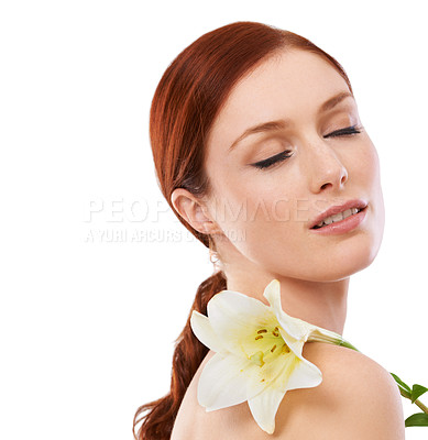 Buy stock photo Beauty, skincare and woman with flower, lily and natural isolated on a white studio background mockup space. Floral cosmetics, organic and model with eyes closed for glow, wellness or facial makeup