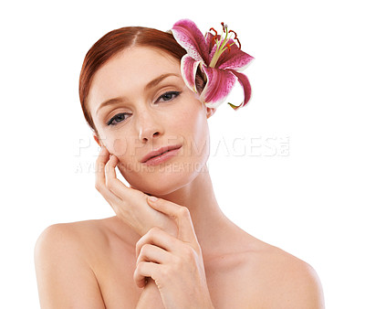 Buy stock photo Beauty, flower and portrait of woman in studio with natural, organic and skincare routine for wellness. Cosmetic, glow and person with floral plant for face dermatology treatment by white background.