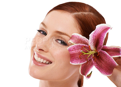 Buy stock photo Skincare, flower and portrait of woman in studio with natural, organic and beauty routine for wellness. Cosmetic, glow and person with floral plant for face dermatology treatment by white background.
