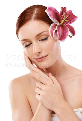 Buy stock photo Cosmetic, flower and woman in studio with natural, organic and beauty face routine for wellness. Skincare, glow and person with floral plant for facial dermatology treatment by white background.