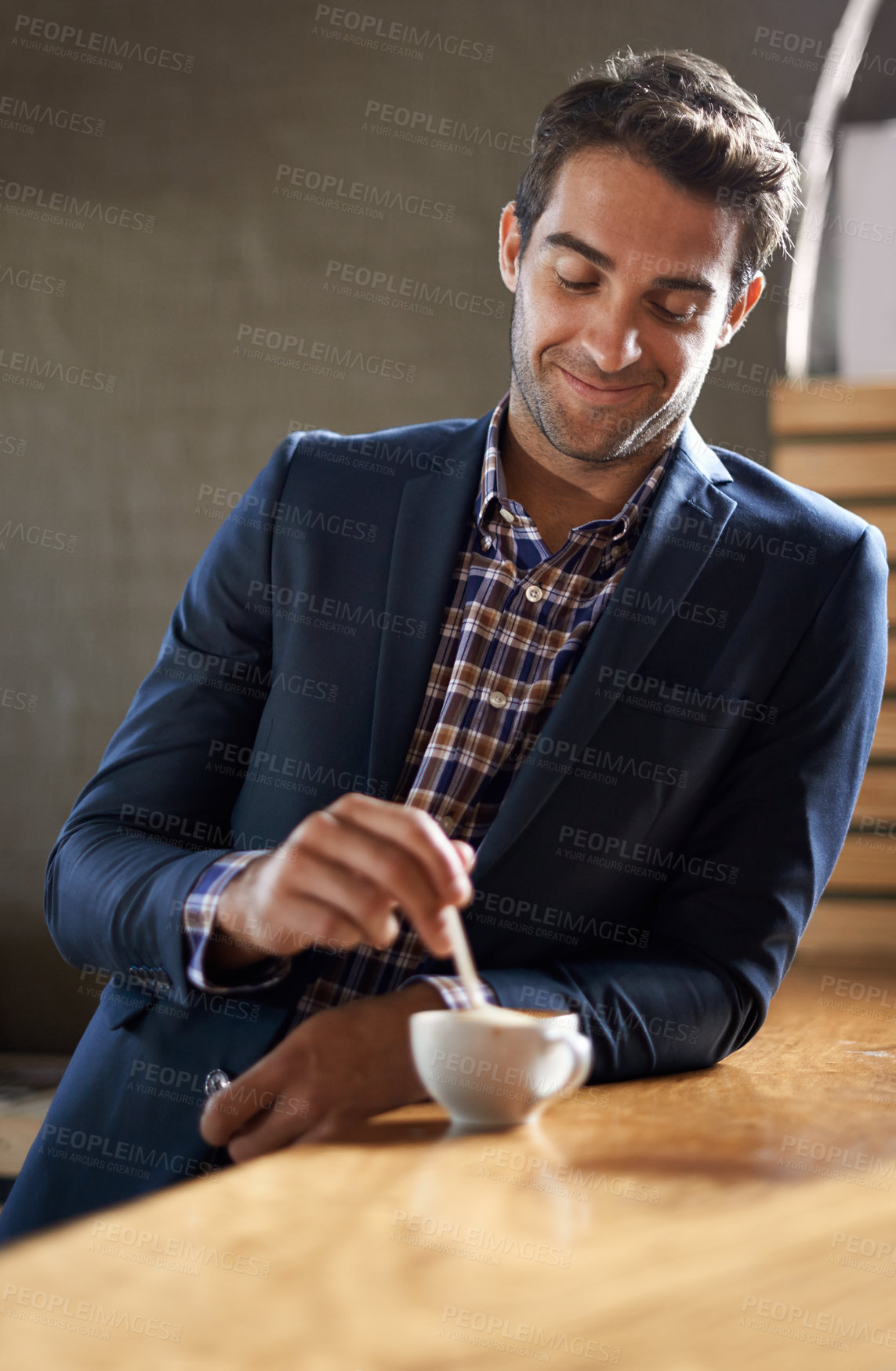 Buy stock photo Professional man at cafe, happy with coffee and relax on a break and leaning against countertop. Hospitality industry, male business person at restaurant with smile on face and stirring drink