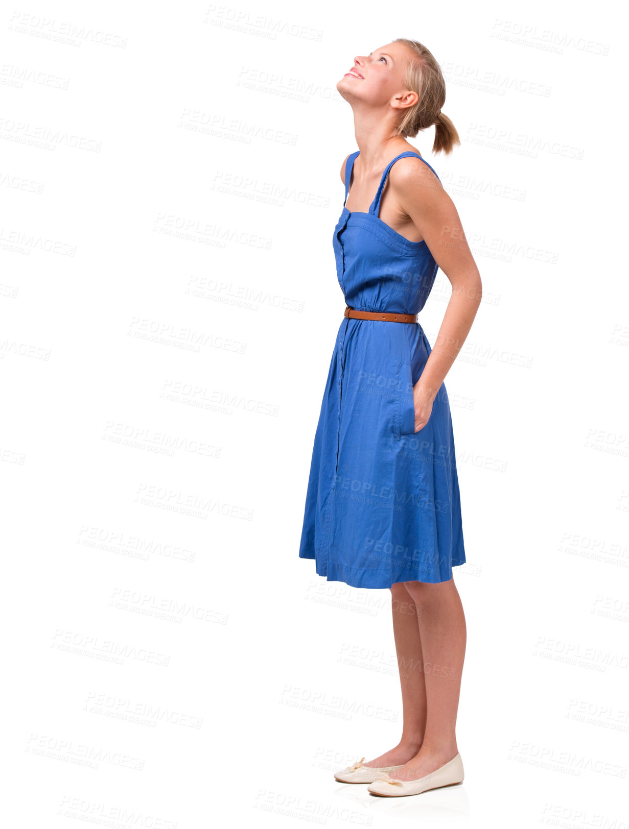 Buy stock photo Shot of a beautiful young woman in a dress looking up isolated on white
