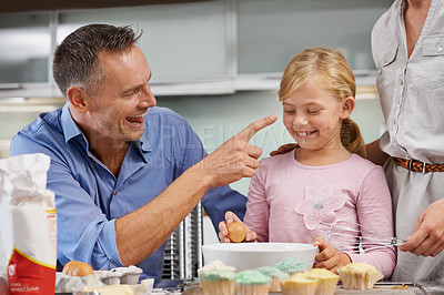 Buy stock photo Father, play or child baking in kitchen or happy family with an excited girl learning cupcake recipe. Home, daughter or mother with dad, muffin or smile for helping or teaching kid for development